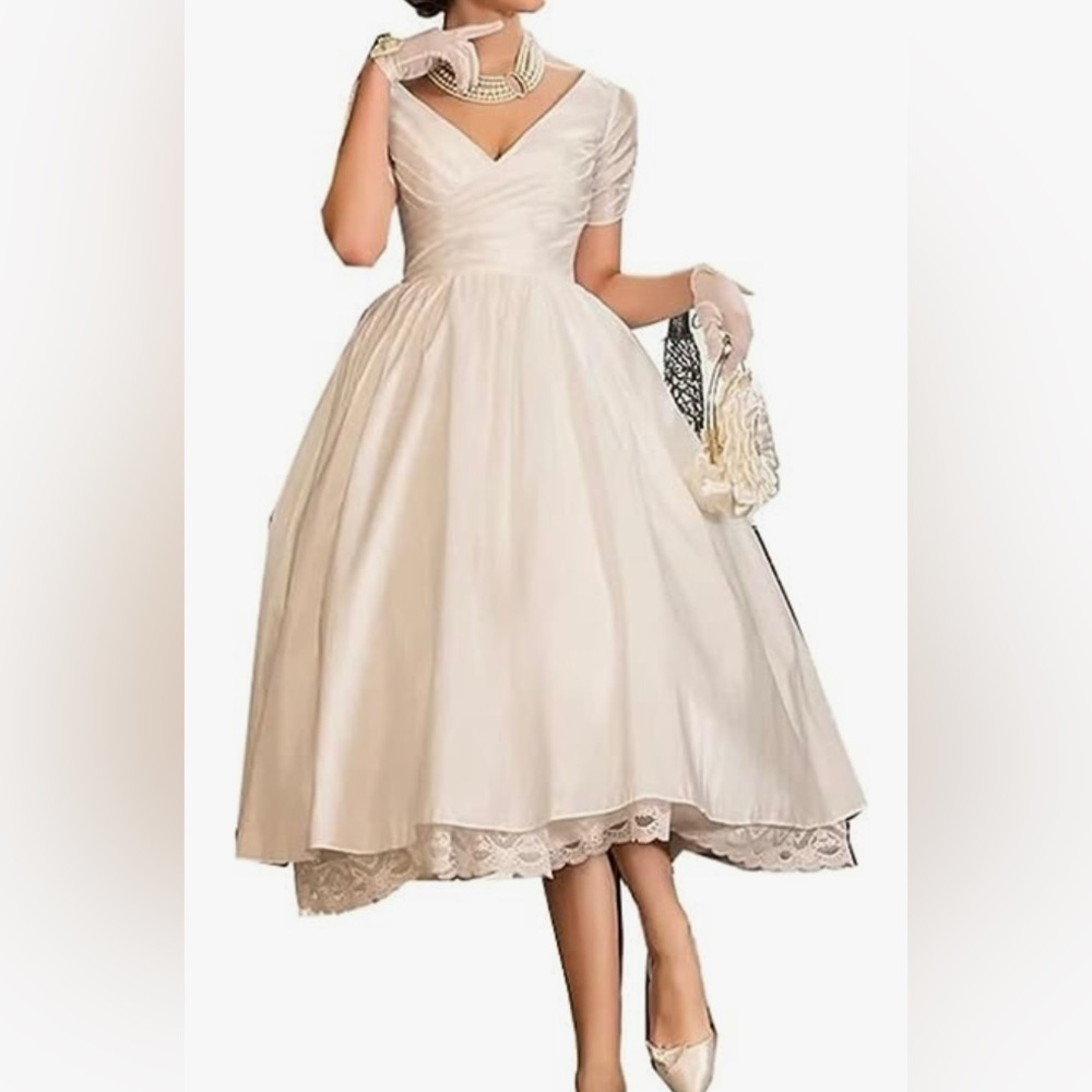 50’s inspired wedding dress.  Ivory size 12.  Brand new